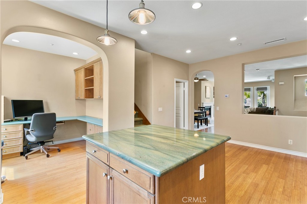21331 Veleta Circle Huntington Beach, CA 92648 - Photo 6 of 14 a kitchen with kitchen island a sink stainless steel appliances and living room view