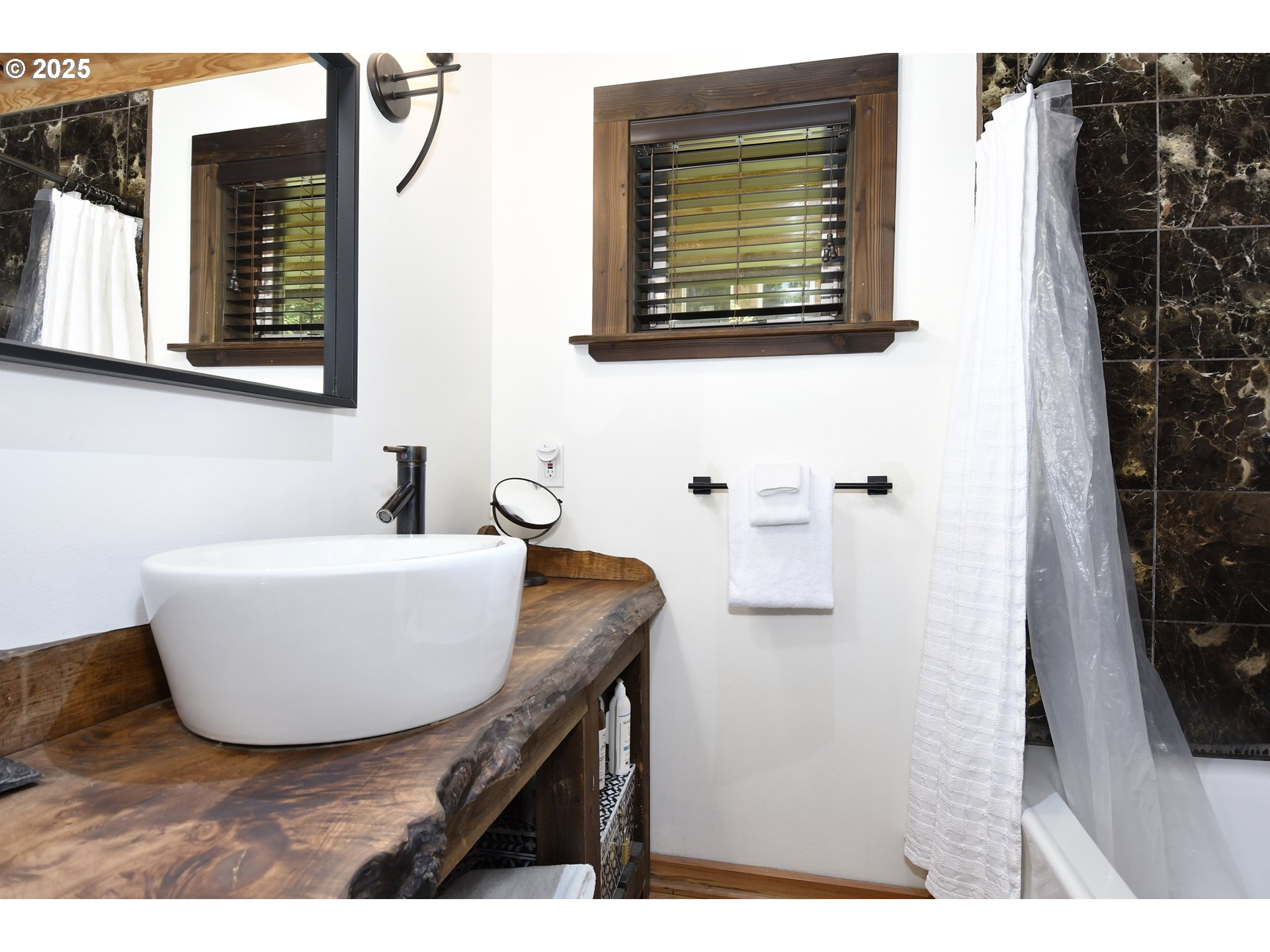 64135 East Relton Road Rhododendron, OR 97049 - Photo 21 of 48 a bathroom with a sink and a mirror