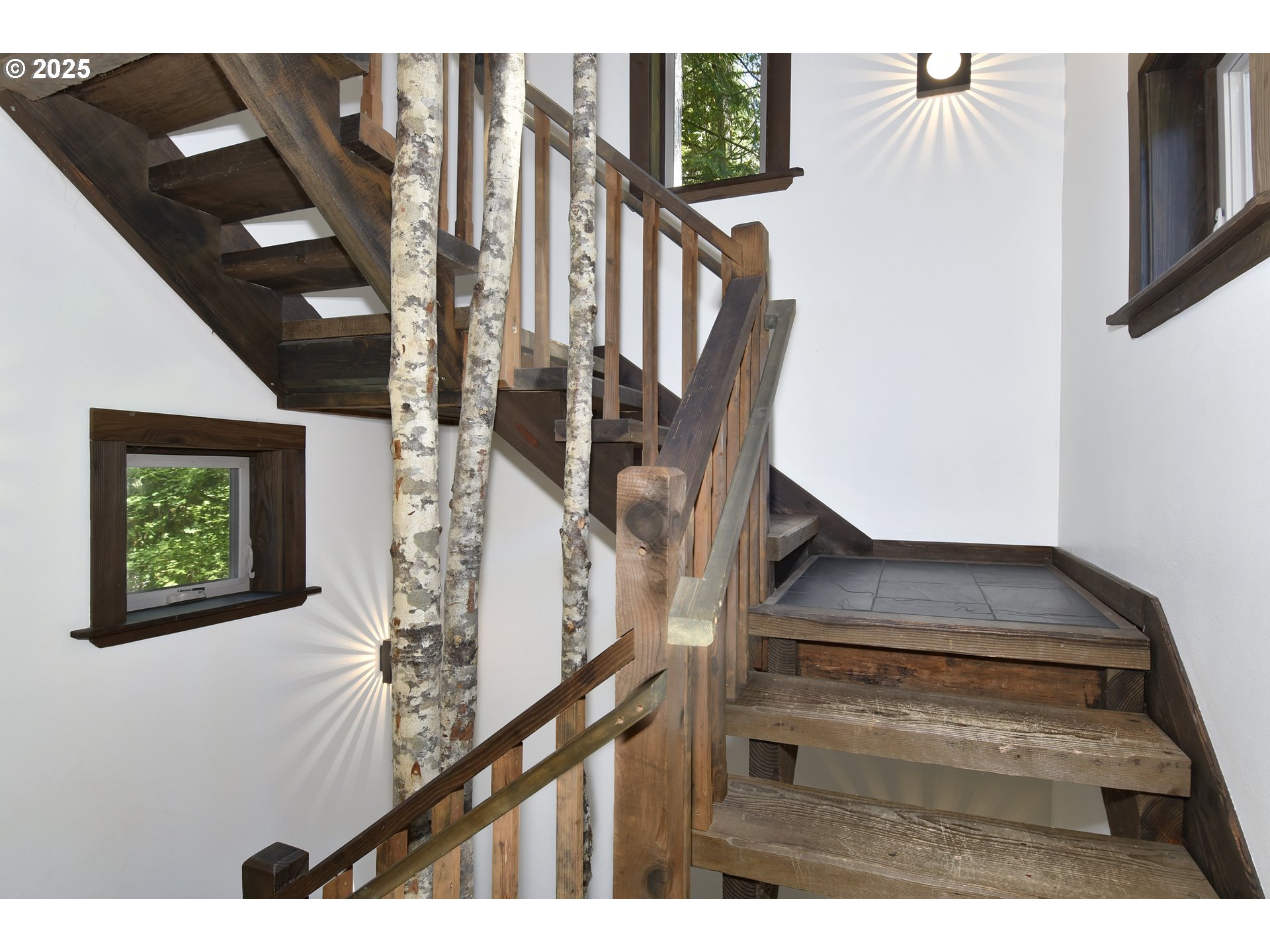64135 East Relton Road Rhododendron, OR 97049 - Photo 22 of 48 a view of staircase with lots of frames on wall