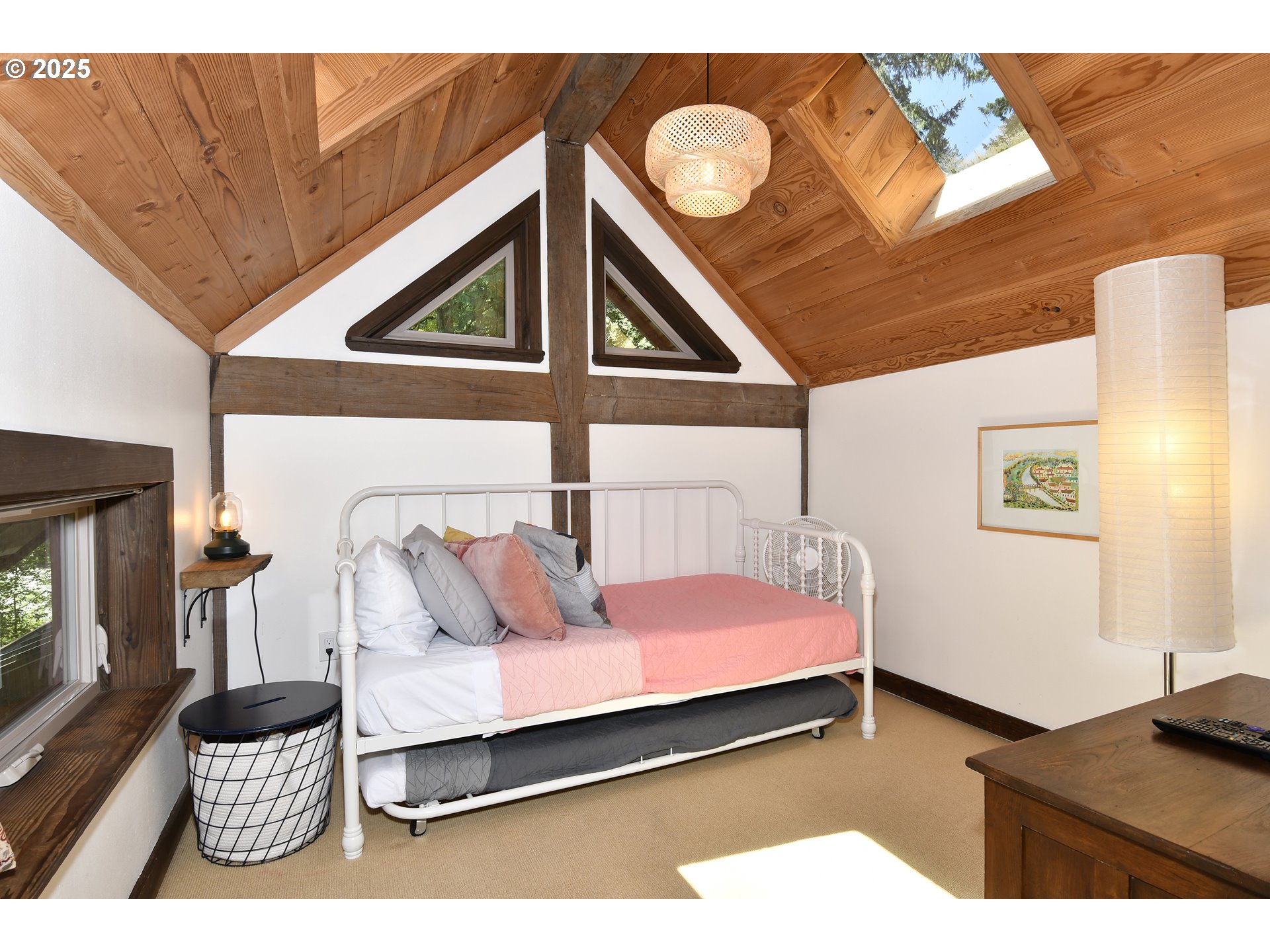 64135 East Relton Road Rhododendron, OR 97049 - Photo 31 of 48 a bedroom with a bed and wooden floor