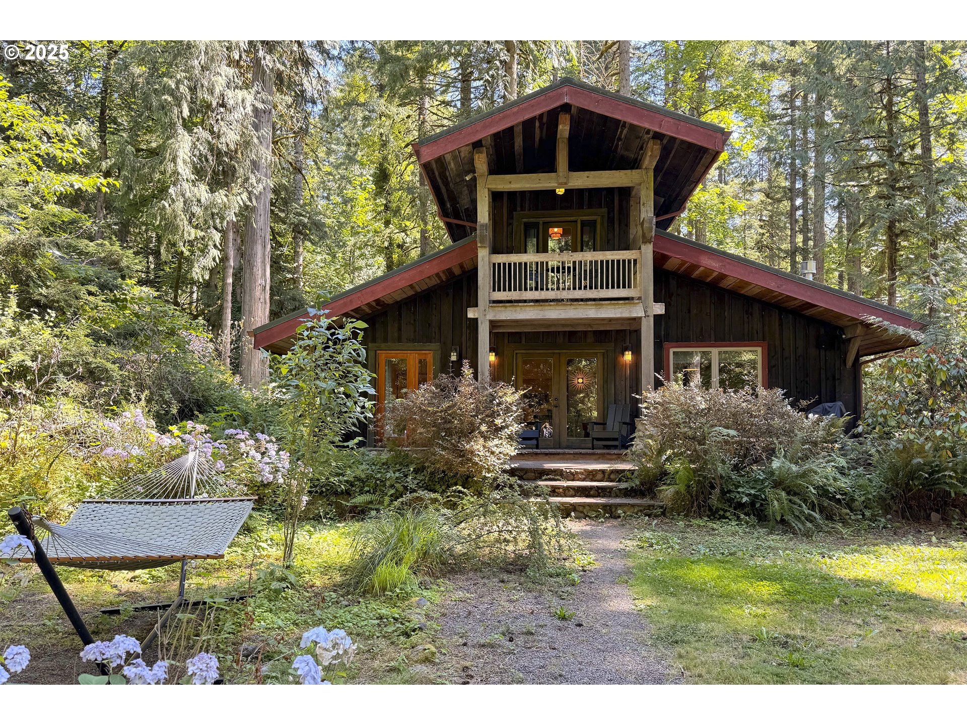 64135 East Relton Road Rhododendron, OR 97049 - Photo 36 of 48 a view of front of house with a yard