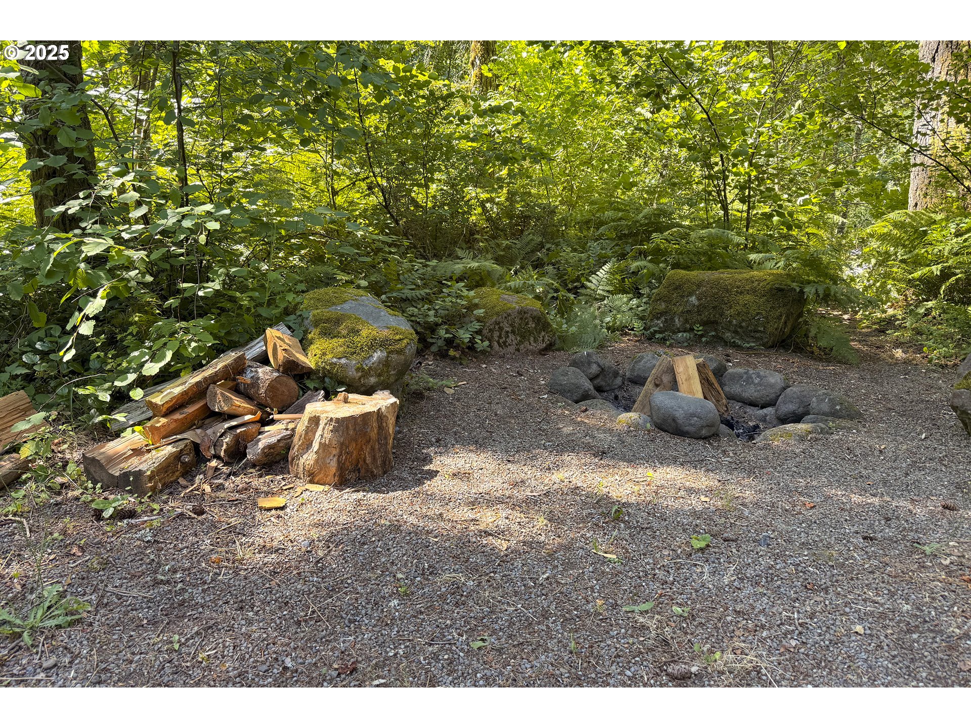 64135 East Relton Road Rhododendron, OR 97049 - Photo 42 of 48 a backyard of a house with table and chairs