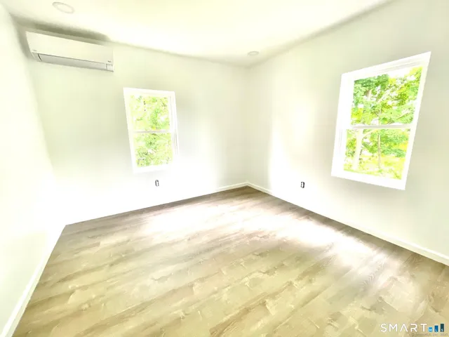 a view of an empty room and a window