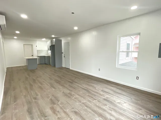 a view of a kitchen with a sink and a window