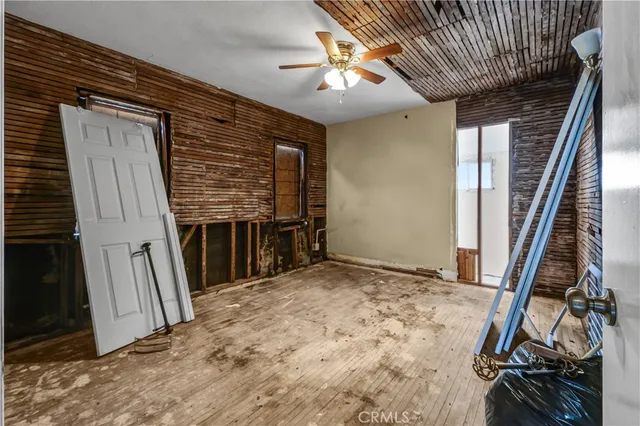 a view of a livingroom with furniture and staircase