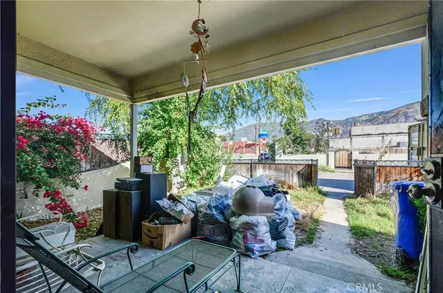 a outdoor living space with furniture and garden view