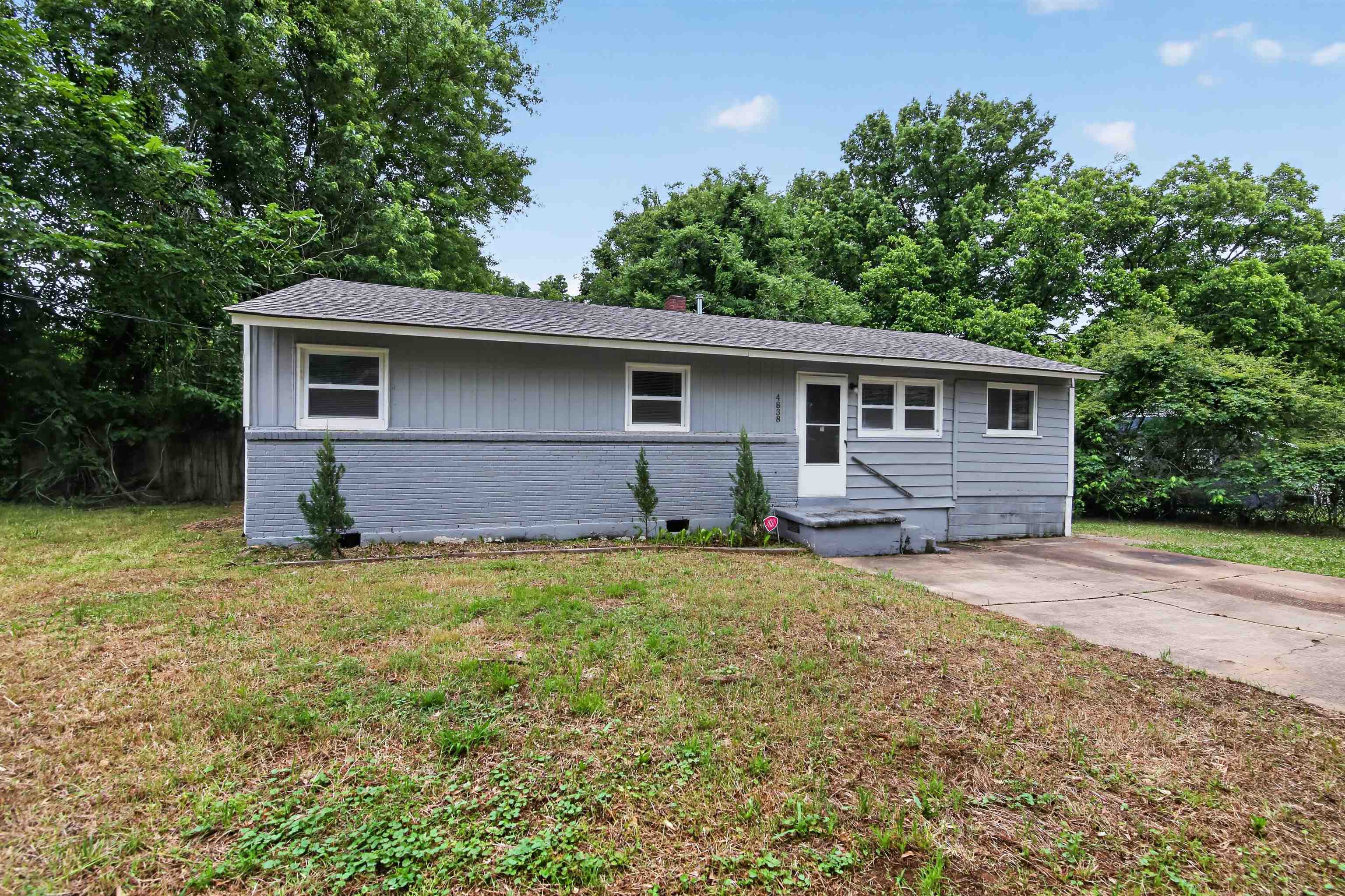4838 Manson Road Memphis, TN 38109 - Photo 2 of 28 Ranch-style residence featuring grey siding and a painted brick foundation