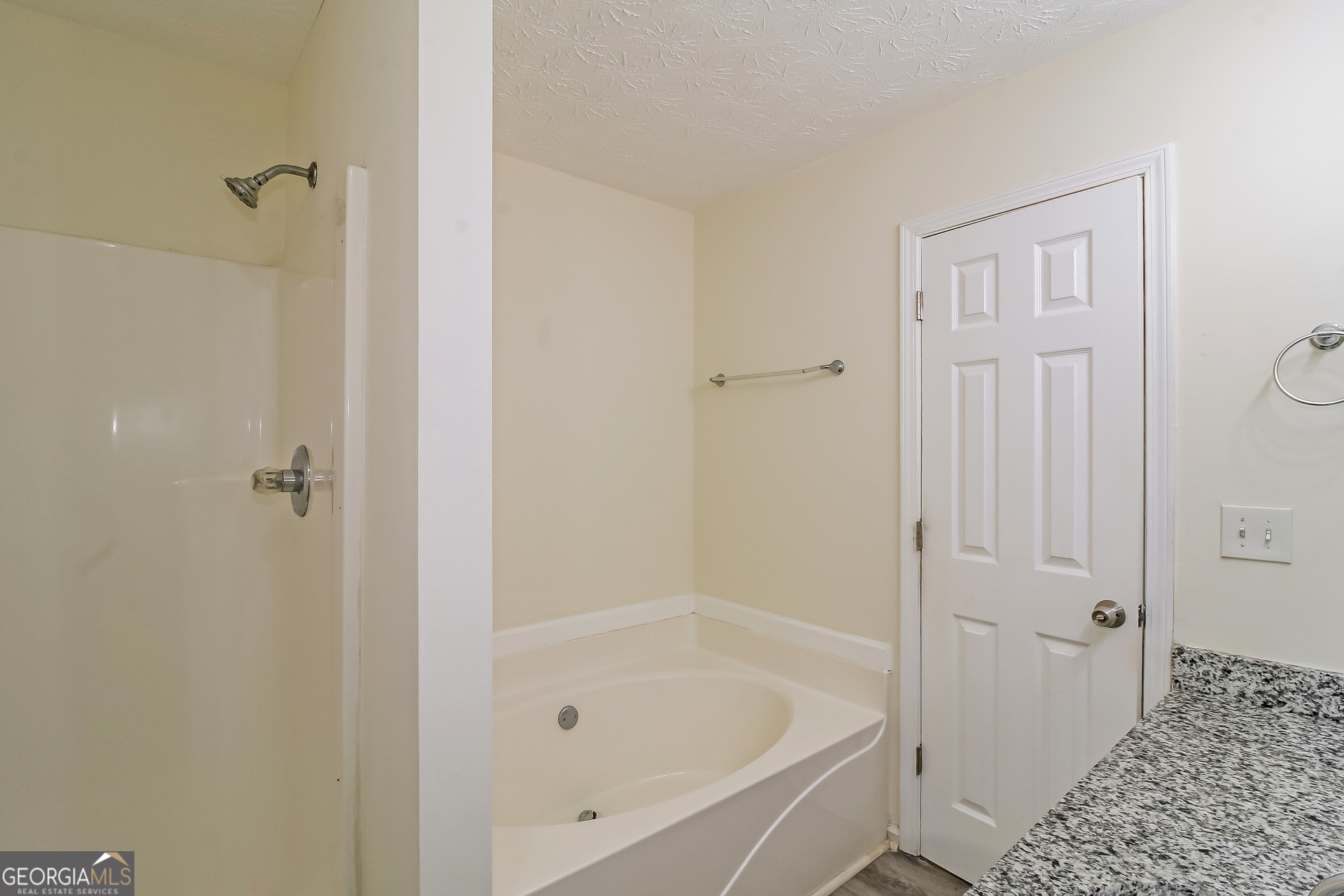 7023 Setters Way Lithonia, GA 30038 - Photo 12 of 21 a bathroom with a bathtub