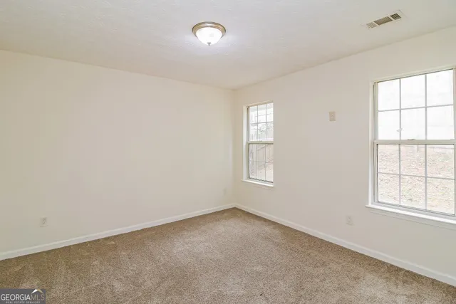 an empty room with windows