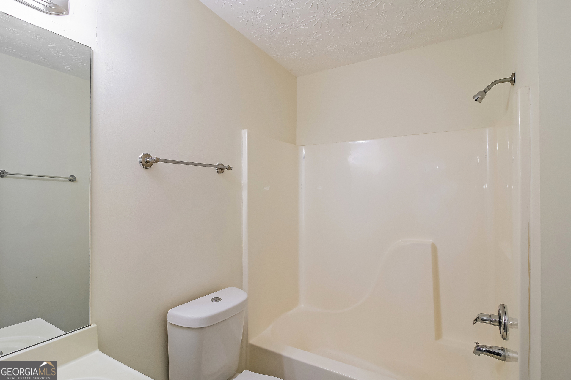 7023 Setters Way Lithonia, GA 30038 - Photo 17 of 21 a white toilet sitting next to a bath tub