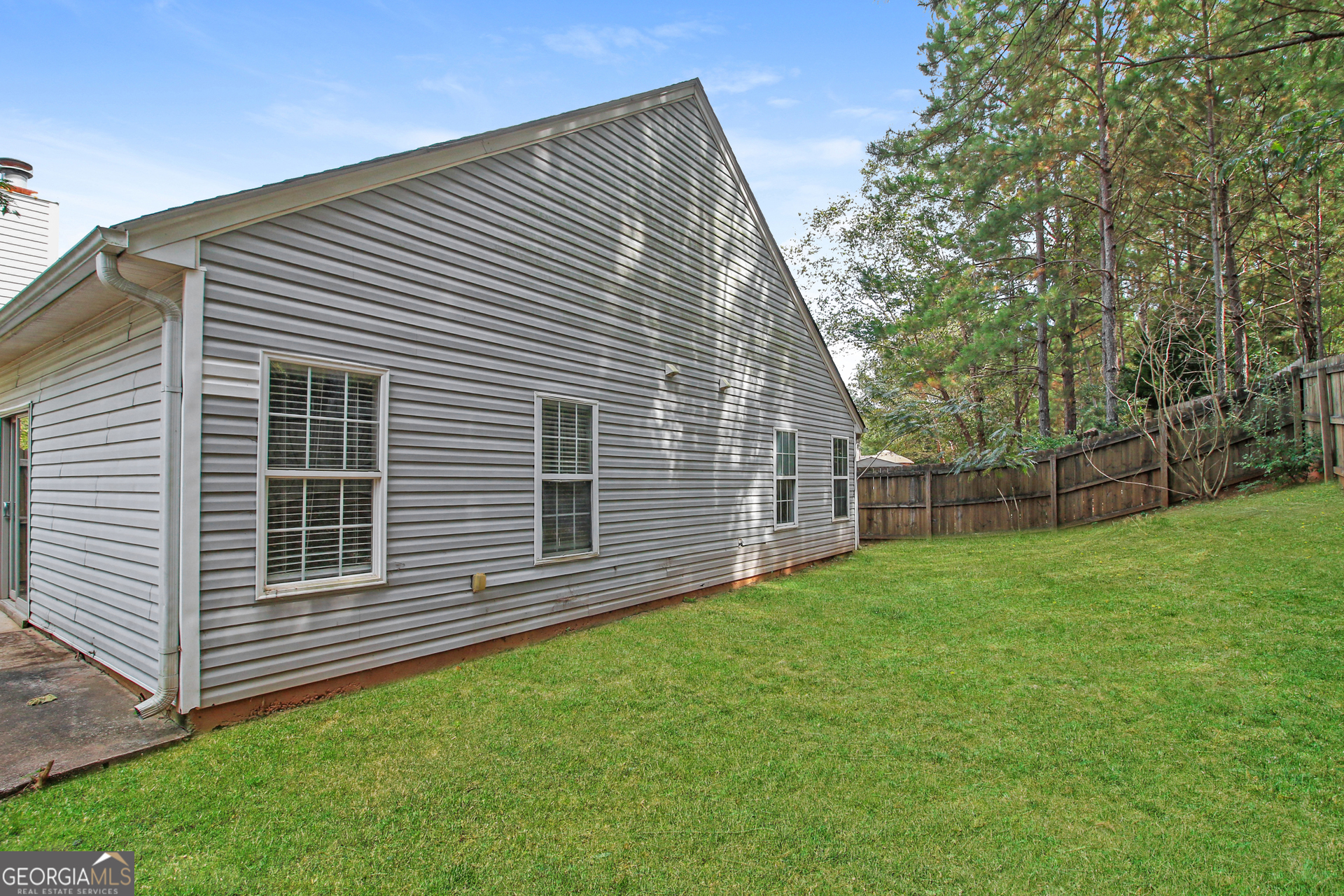 7023 Setters Way Lithonia, GA 30038 - Photo 18 of 21 a front view of a house with a garden