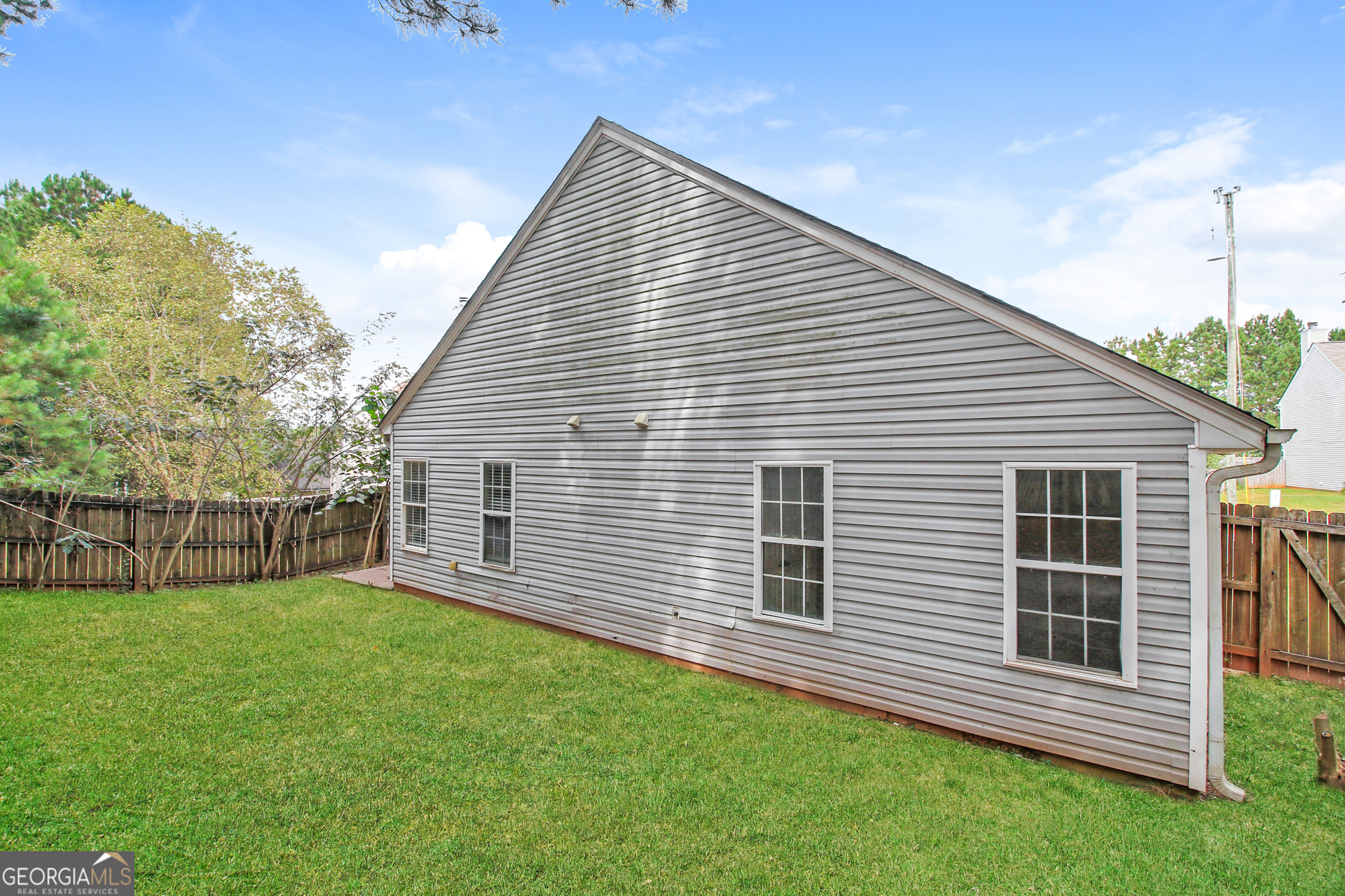 7023 Setters Way Lithonia, GA 30038 - Photo 19 of 21 a view of a backyard with a garden