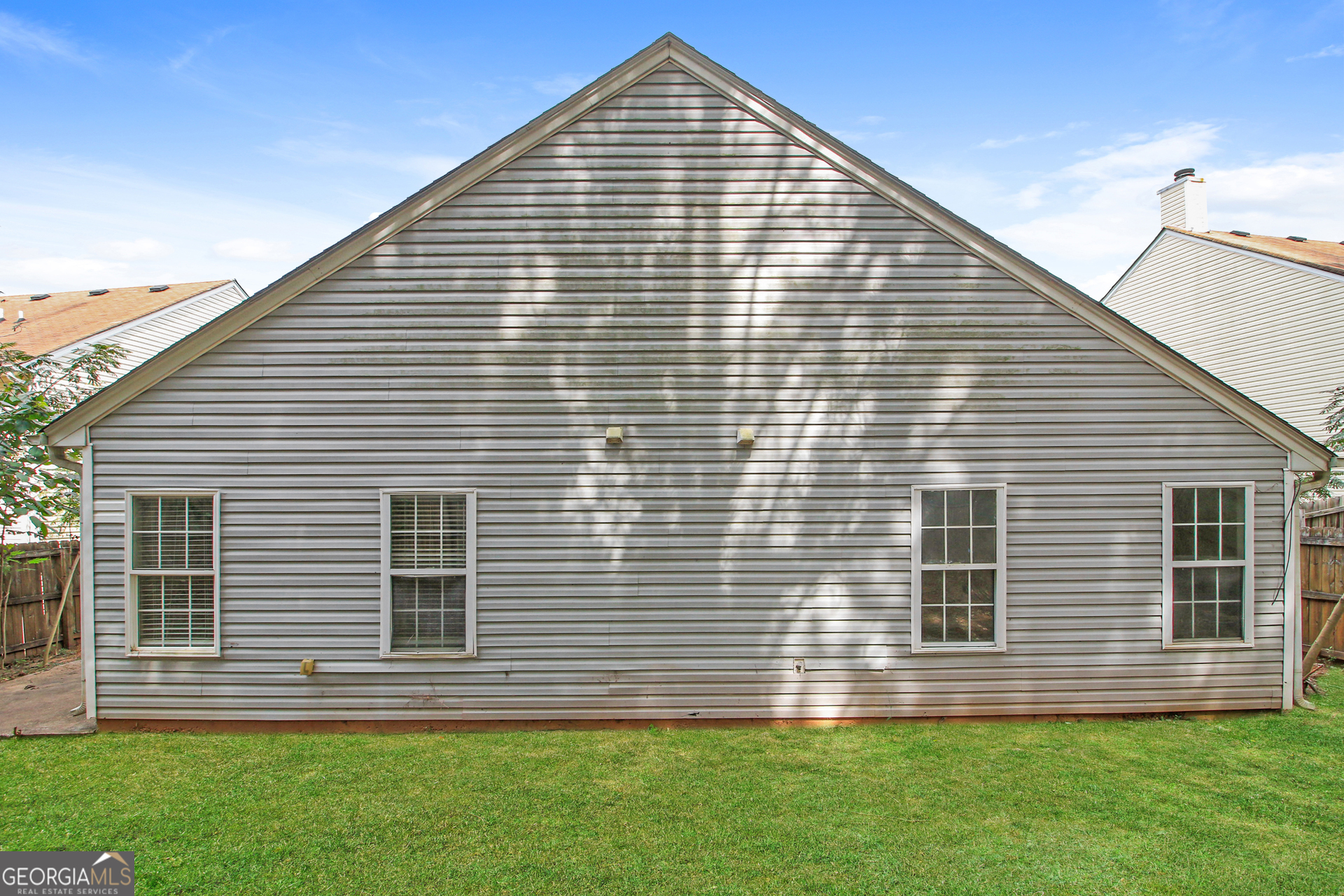 7023 Setters Way Lithonia, GA 30038 - Photo 20 of 21 a front view of a house with a yard