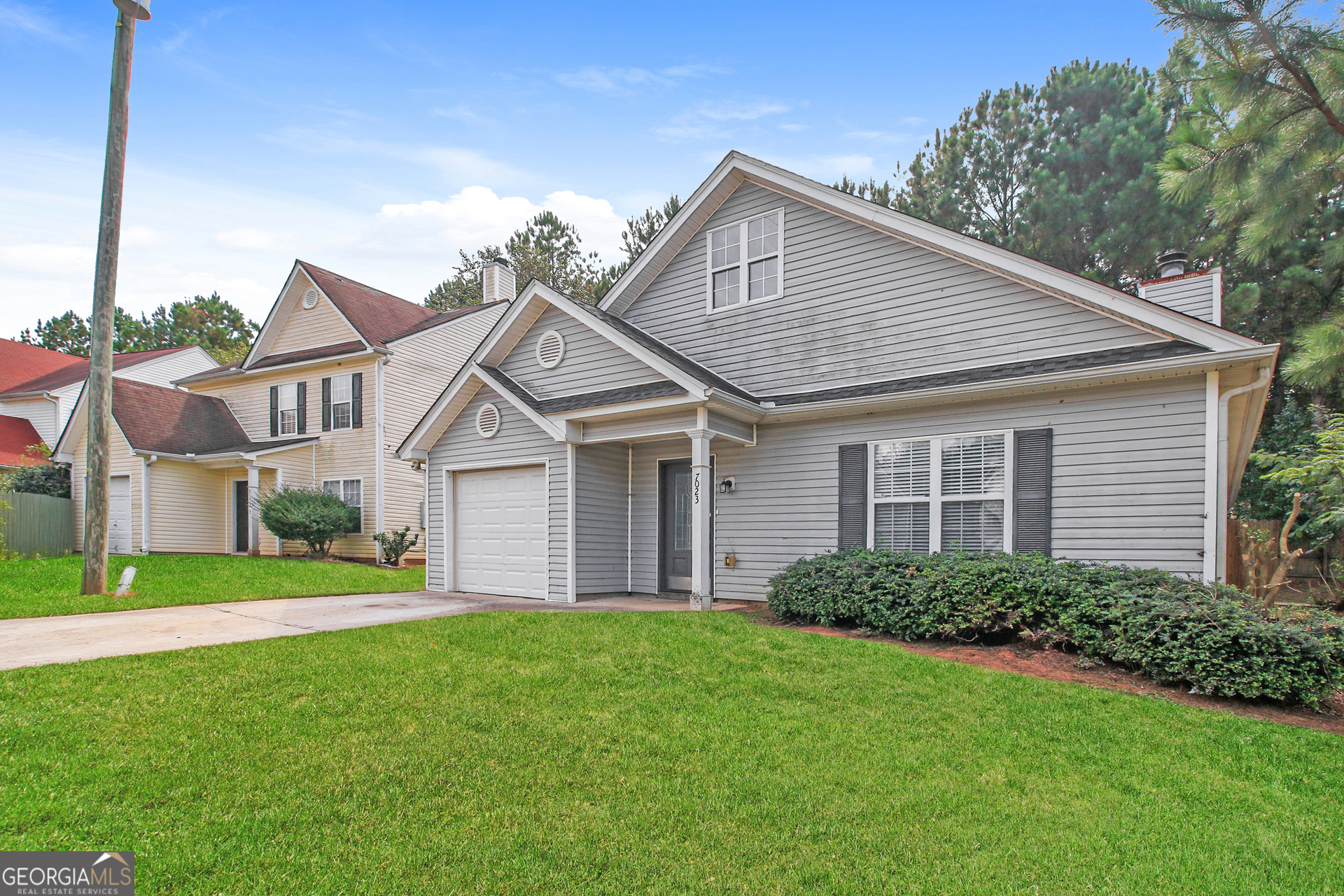 7023 Setters Way Lithonia, GA 30038 - Photo 2 of 21 a view of a yard in front of a house
