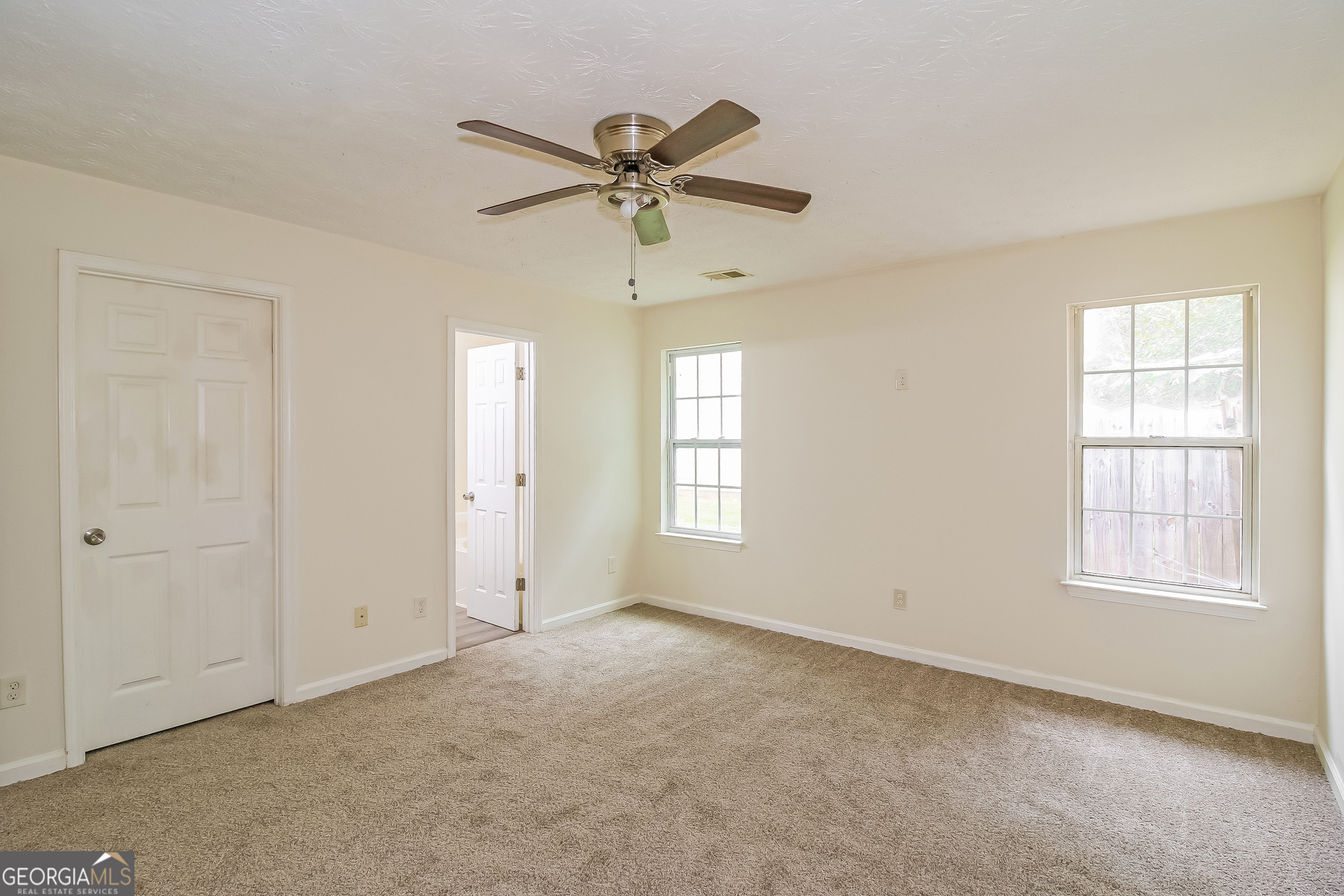 7023 Setters Way Lithonia, GA 30038 - Photo 9 of 21 a view of an empty room with a window