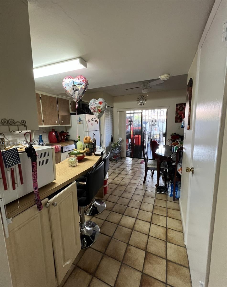 5866 West 18th Avenue, Unit 3023 Hialeah, FL 33012 - Photo 5 of 10 a kitchen with lots of counter top space