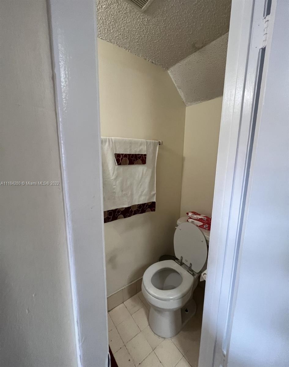 5866 West 18th Avenue, Unit 3023 Hialeah, FL 33012 - Photo 7 of 10 a bathroom with a toilet and a sink