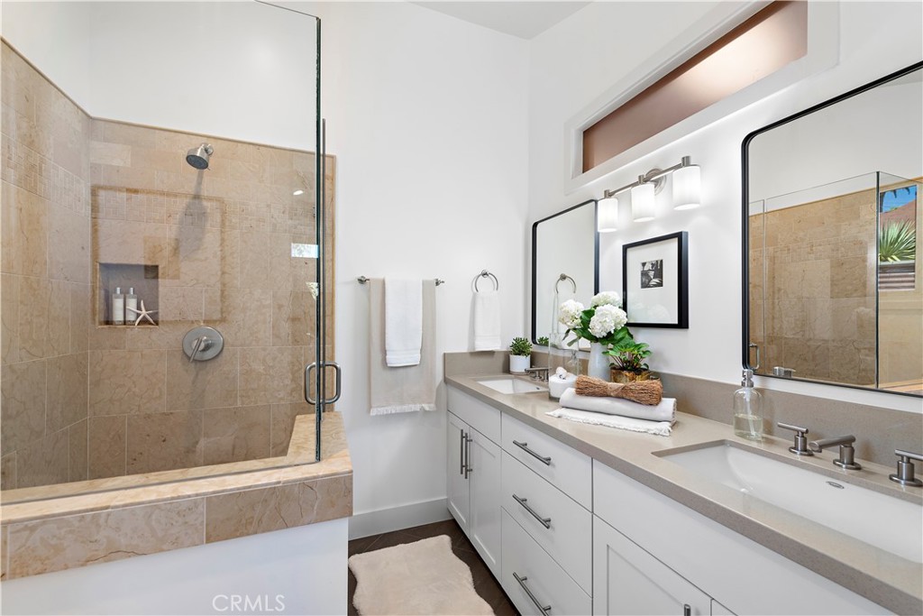 461 Shadow Lane Laguna Beach, CA 92651 - Photo 15 of 54 a spacious bathroom with a granite countertop sink mirror and shower