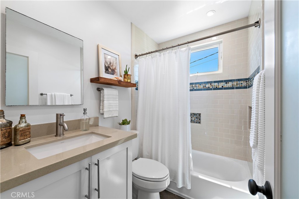 461 Shadow Lane Laguna Beach, CA 92651 - Photo 17 of 54 a bathroom with a granite countertop sink toilet and shower
