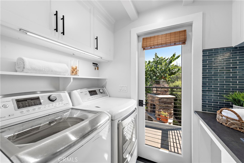 461 Shadow Lane Laguna Beach, CA 92651 - Photo 20 of 54 a utility room with dryer and washer