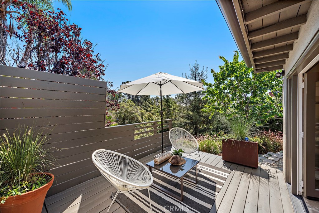 461 Shadow Lane Laguna Beach, CA 92651 - Photo 23 of 54 a backyard of a house with wooden floor yard fire pit and outdoor seating