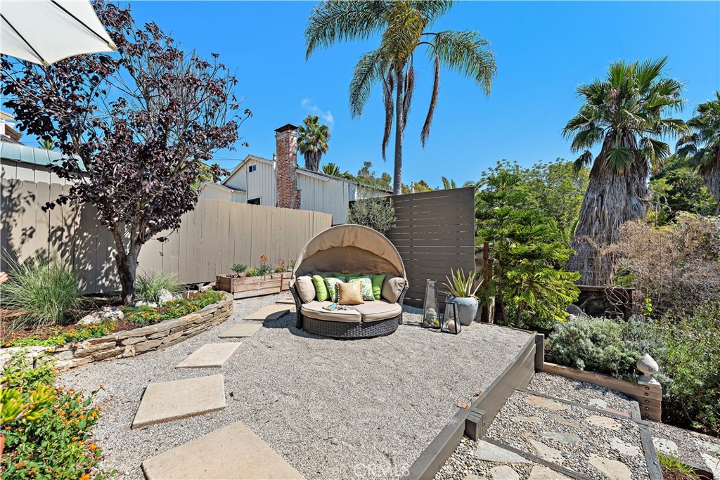 461 Shadow Lane Laguna Beach, CA 92651 - Photo 26 of 54 a front view of a house with a yard and potted plants