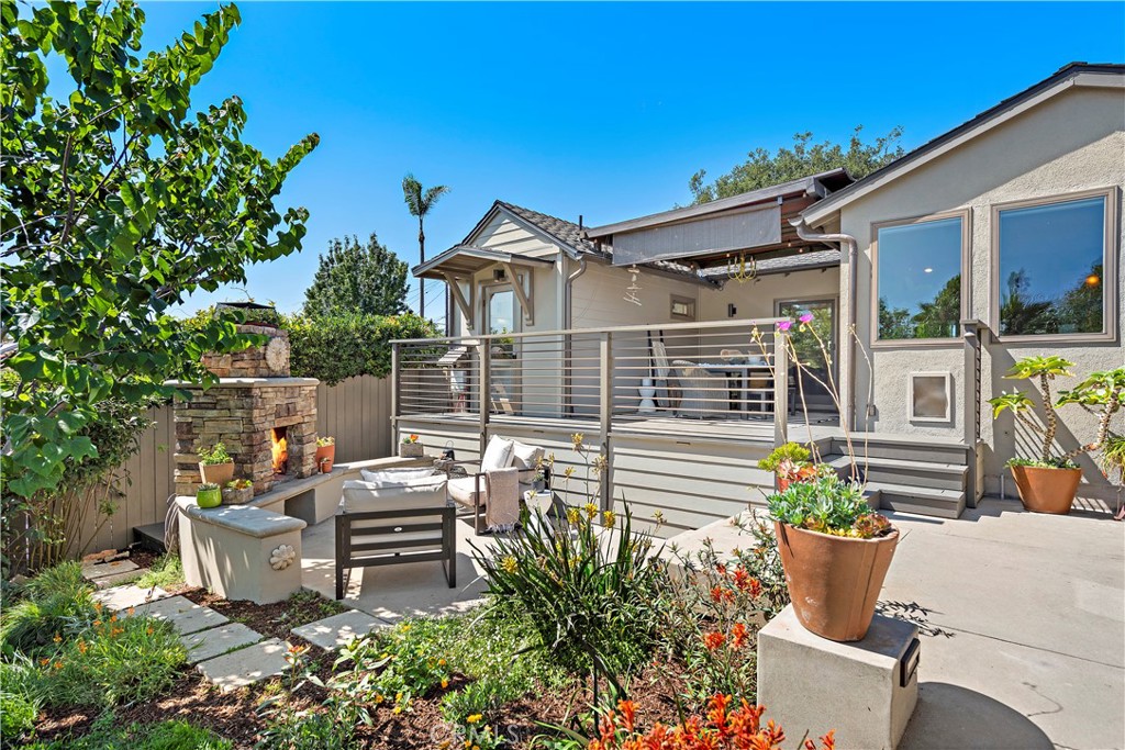 461 Shadow Lane Laguna Beach, CA 92651 - Photo 38 of 54 a view of a patio with table and chairs and potted plants