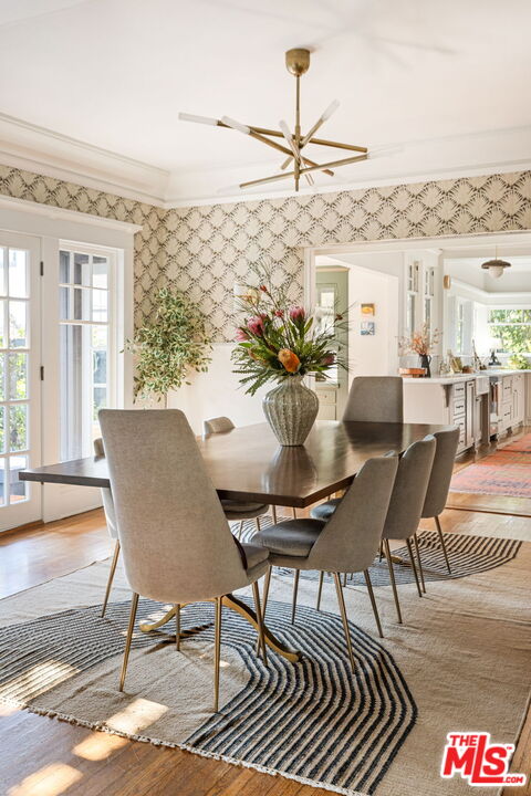 375 North Ridgewood Place Los Angeles, CA 90004 - Photo 15 of 56 a dining room with furniture a rug and a chandelier