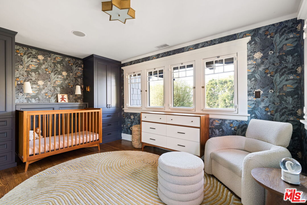 375 North Ridgewood Place Los Angeles, CA 90004 - Photo 35 of 56 a bedroom with a bed and a window