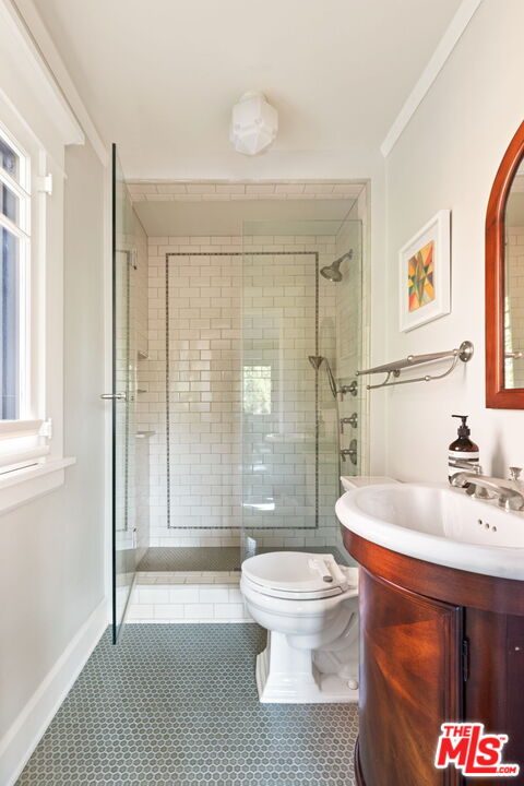 375 North Ridgewood Place Los Angeles, CA 90004 - Photo 37 of 56 a bathroom with a sink toilet and shower