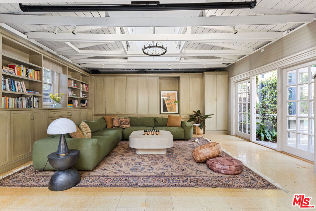 375 North Ridgewood Place Los Angeles, CA 90004 - Photo 47 of 56 a living room with furniture and a large window