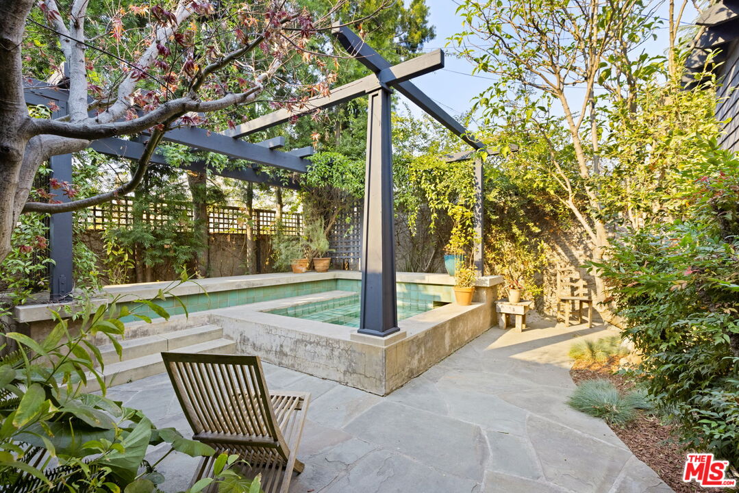 375 North Ridgewood Place Los Angeles, CA 90004 - Photo 50 of 56 a view of porch with a bench in patio