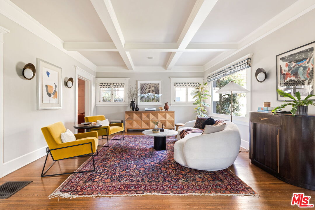 375 North Ridgewood Place Los Angeles, CA 90004 - Photo 5 of 56 a living room with furniture a rug and wooden floor
