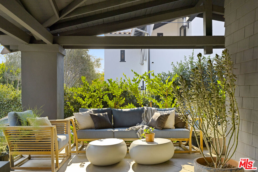 375 North Ridgewood Place Los Angeles, CA 90004 - Photo 56 of 56 a wooden bench sitting in front of a building