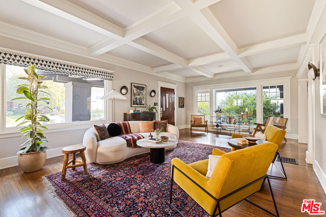 375 North Ridgewood Place Los Angeles, CA 90004 - Photo 7 of 56 a living room with furniture wooden floor and a table