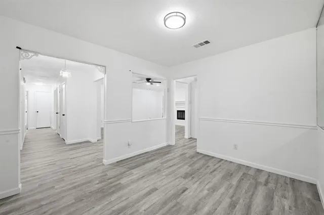 a view of a livingroom with wooden floor