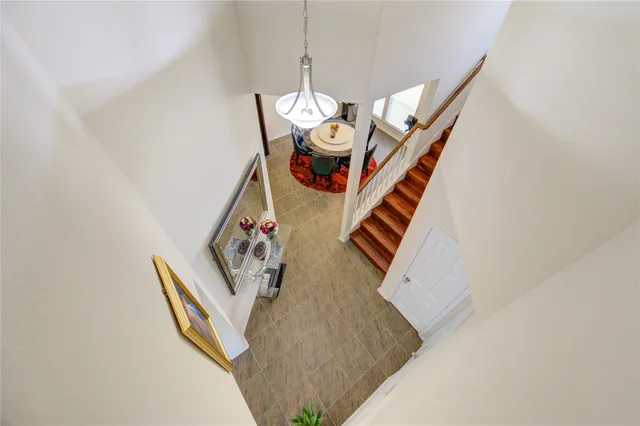 a kitchen with stainless steel appliances granite countertop a sink counter space cabinets and a large window