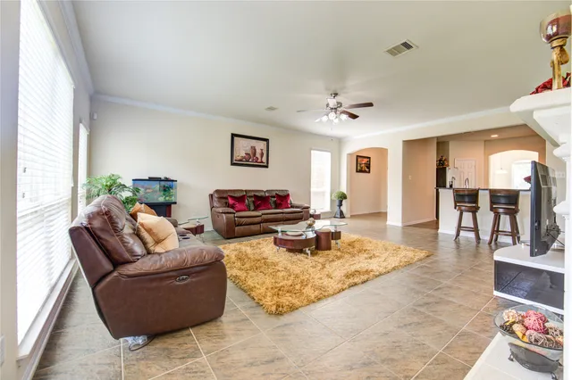 a bedroom with bed and a mirror