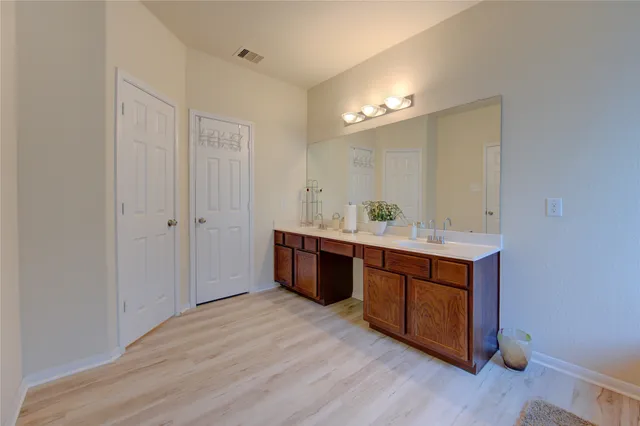 a bathroom with a tub and shower