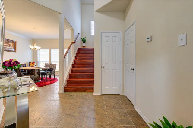 a view of entryway with stairs and toys