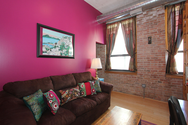 1910 South Indiana Avenue, Unit 321 Chicago, IL 60616 - Photo 11 of 25 a living room with furniture and a window