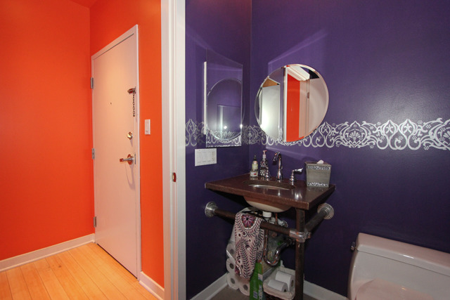1910 South Indiana Avenue, Unit 321 Chicago, IL 60616 - Photo 19 of 25 a view of a bathroom with a sink and mirror
