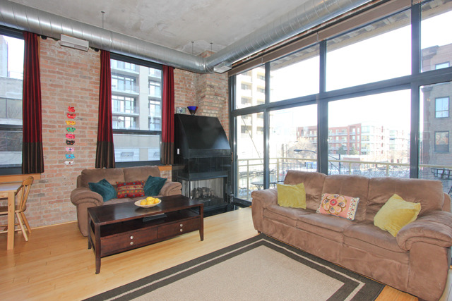 1910 South Indiana Avenue, Unit 321 Chicago, IL 60616 - Photo 3 of 25 a living room with furniture and a large window
