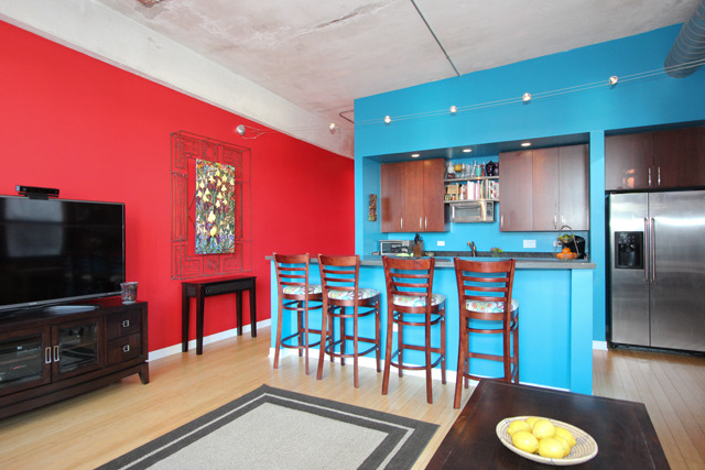 1910 South Indiana Avenue, Unit 321 Chicago, IL 60616 - Photo 5 of 25 a kitchen with stainless steel appliances dining table a chair and a refrigerator