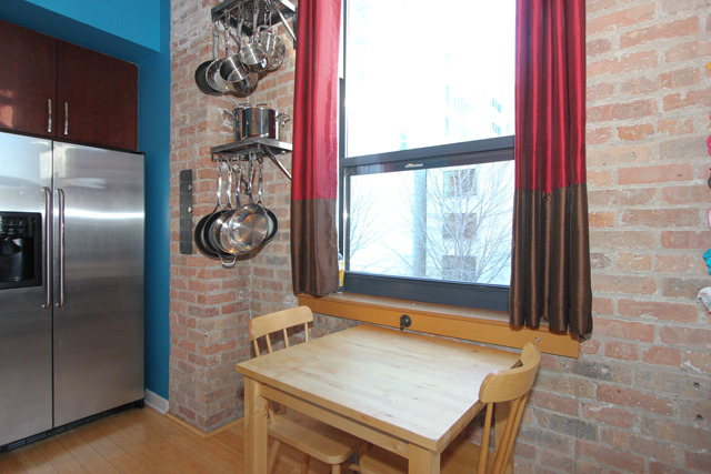 1910 South Indiana Avenue, Unit 321 Chicago, IL 60616 - Photo 9 of 25 a room with a door and a table