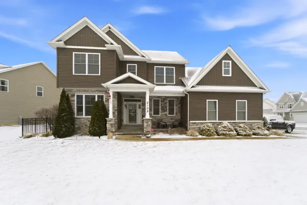 an aerial view of a house with a ocean view