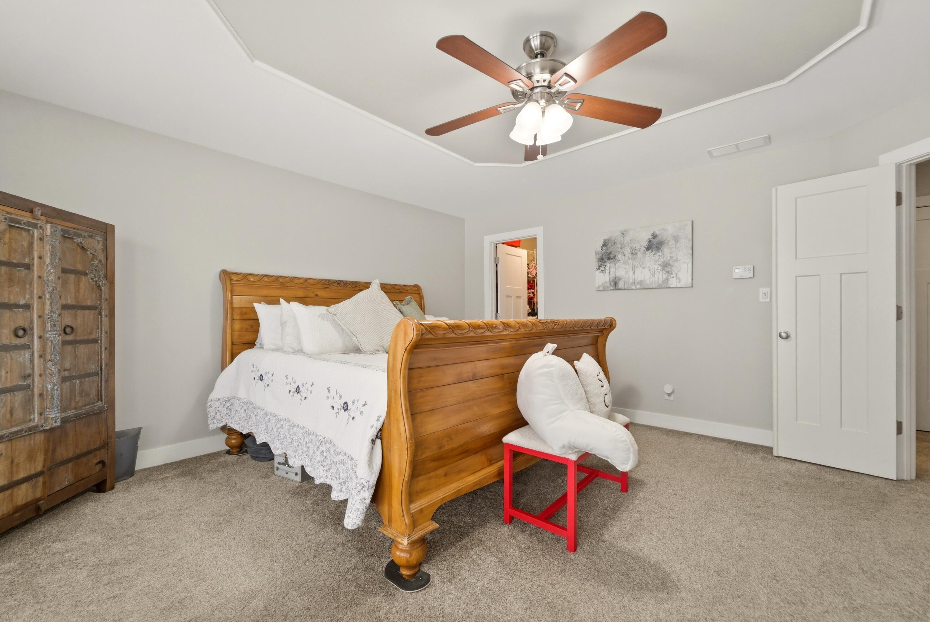 2102 Pradera Trail Chesterton, IN 46304 - Photo 35 of 50 a bedroom with a bed and a chandelier