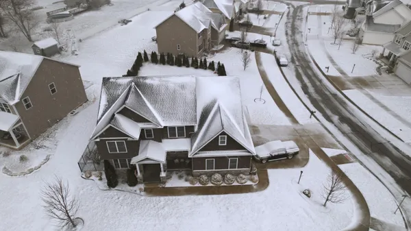 a kitchen with granite countertop white cabinets stainless steel appliances and a sink