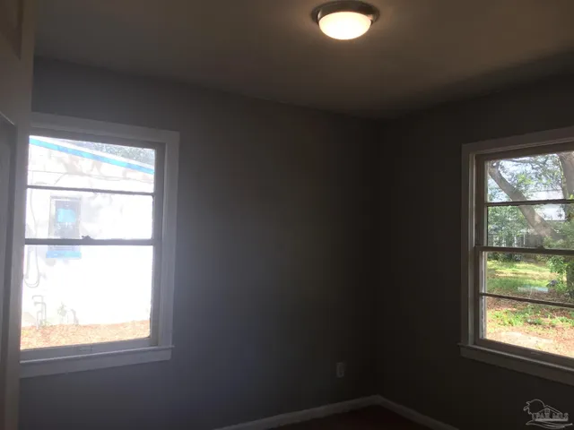 a view of an empty room and window