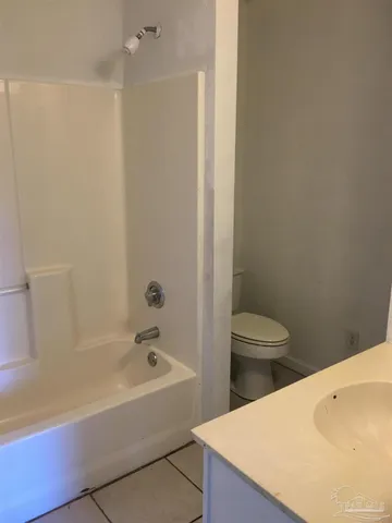 a bathroom with a bathtub and toilet